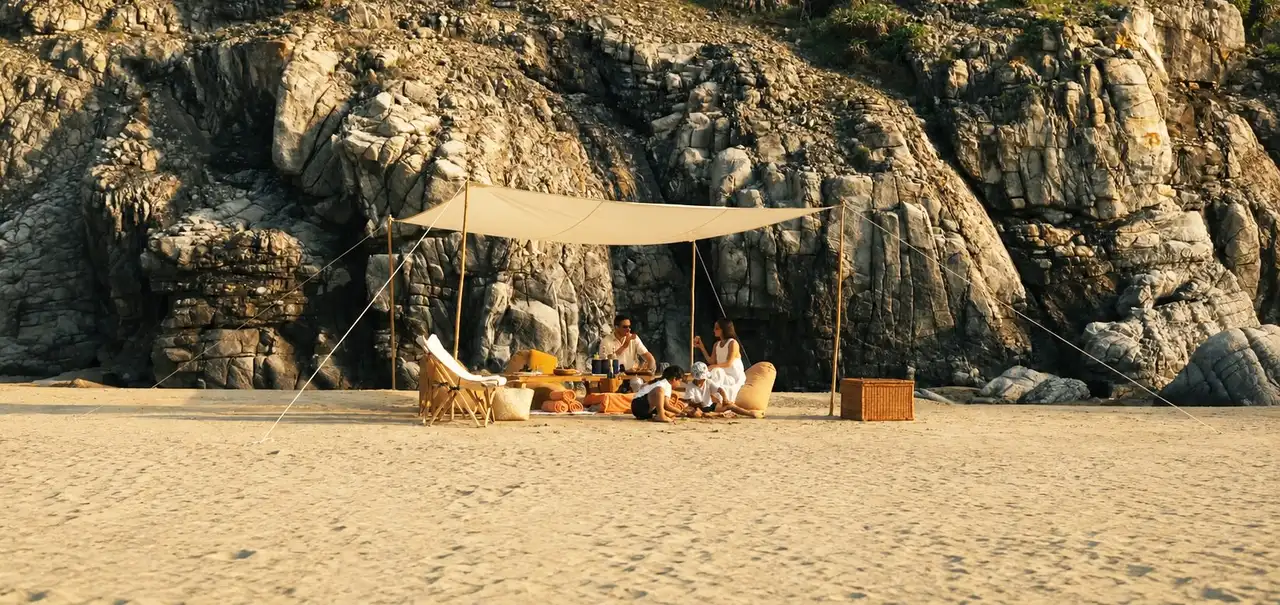 A private beach set-up under a canopy below the rocks on Con Dao